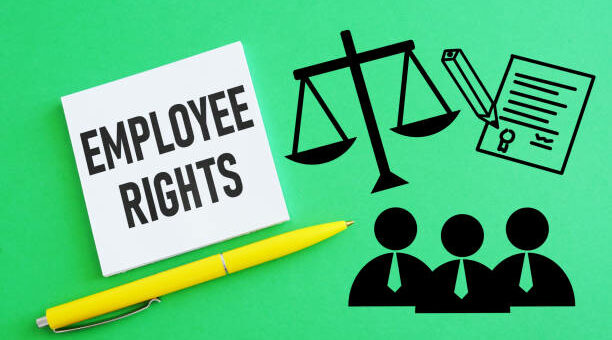 Employment lawyer advising worker on protected workplace rights at office desk