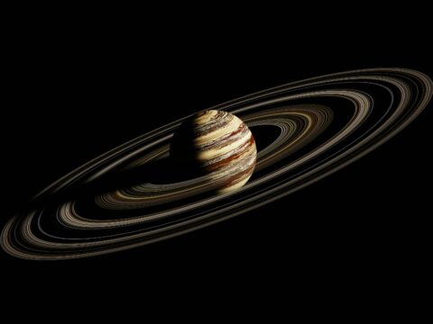 Did a Giant Planet Sculpt Fomalhaut's Stunning Ring into its Squashed Shape?